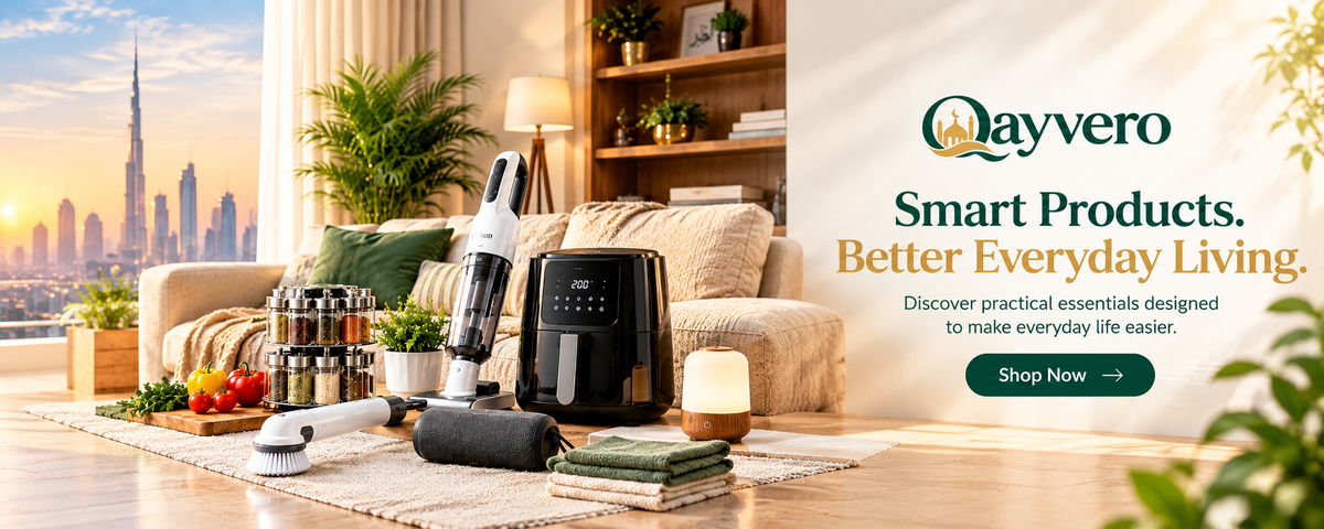 A promotional banner for Qayvero smart products in a modern living room setting. Visible items include a handheld vacuum cleaner, a black air fryer, a small electric grinder, and a candle.
